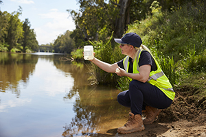 EPA field officer testing water quality, Sandy Beach