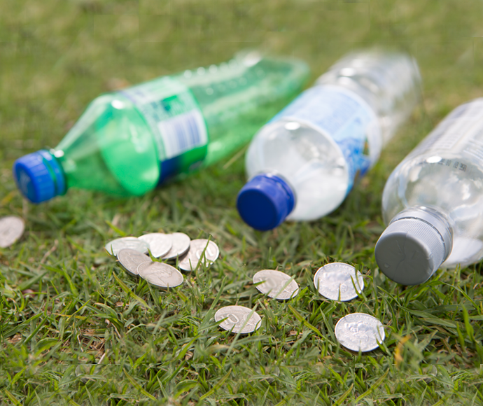 Children with recyclable bottles