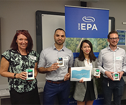 staff holding keep cups make the pledge to reduce use of disposable coffee cups