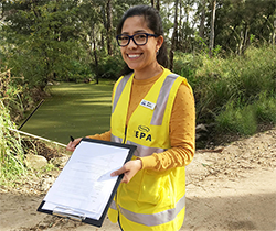 woman holding a clipboard conducting a water use survey