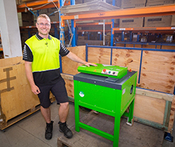 Man beside a cardboard shredder