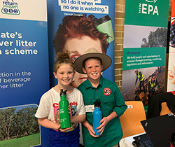 11-year-old Jack Berne and his sister in front of EPA posters