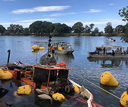 airbags attached to a partially submerged barge