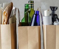 bottles, plastic containers and paper for recycling