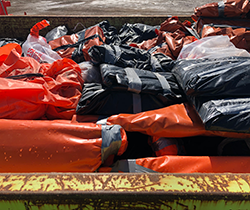 asbestos wrapped in plastic and unsafely disposed of in onsite skip 