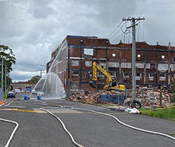 site of Wickham wool store fire with asbestos containment