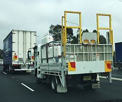 rear view of trucks carrying dangerous good